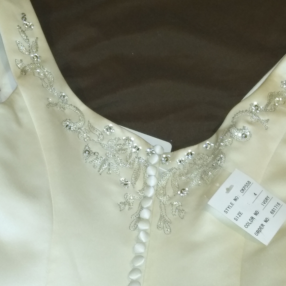 Ivory Olga Cassini wedding/prom dress.